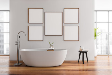 Fototapeta na wymiar Modern bathroom interior with ceramic bathtub and five framed posters above tub. Hardwood flooring. Panoramic window. No people. Mockup. 3d rendering.