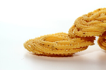 Murukku is a popular South Indian fried snack made with rice flour, lentil flours, spices and seasonings