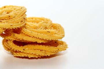 Murukku is a popular South Indian fried snack made with rice flour, lentil flours, spices and seasonings
