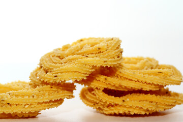Murukku is a popular South Indian fried snack made with rice flour, lentil flours, spices and seasonings