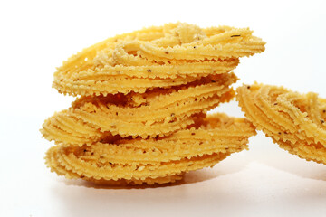 Murukku is a popular South Indian fried snack made with rice flour, lentil flours, spices and seasonings