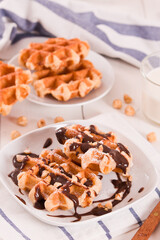 Waffles with chocolate cream and hazelnuts.