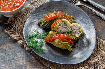 Gołabki - classic Polish dish of cabbage rolls stuffed with pork and rice in tomato sauce