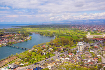 Fototapeta premium Albania. View of Buna river, Shkoder city and Shkodra Lake on sunny spring day
