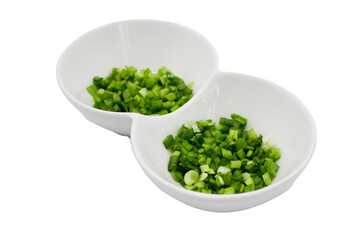Chopped scallions in white plate