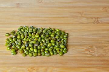 green peas on wooden background