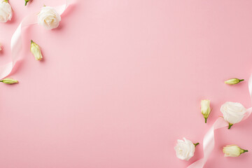 Top view photo of woman's day composition curly pink satin ribbon and prairie gentian flower buds on isolated pastel pink background with empty space