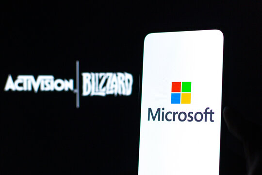 West Bangal, India - January 22, 2022 : Microsoft and blizzard deal logo on phone and laptop screen stock image.