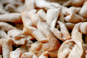 Angel wings called in Poland faworki or chrust  cakes deep fried in oil to celebrate Fat Thursday....