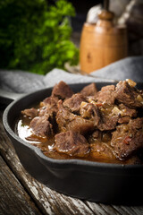 Beef stew in a cast iron skillet.
