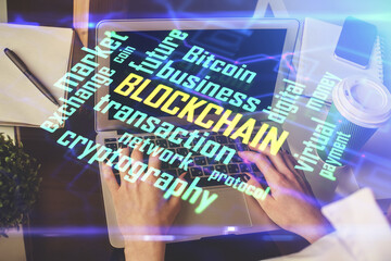Double exposure of woman hands typing on computer and crypto market theme hologram drawing. Blockchain concept.