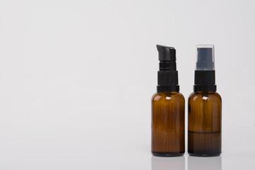 on a white background, with a place for an inscription, two bottles of massage oil