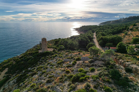 Drone view of an ancient medieval tower of Mediterranean Sea coast defence in Spain. Torre de la Corda in Oropesa, Spain