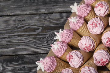 Zephyr in waffle cones. Decorated with decorative sprinkles and mastic snowflakes.