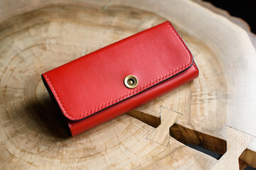 hand made red leather wallet . Leather craft. Selective focus