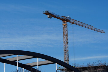 Crane in front of blue sky on a sunny day