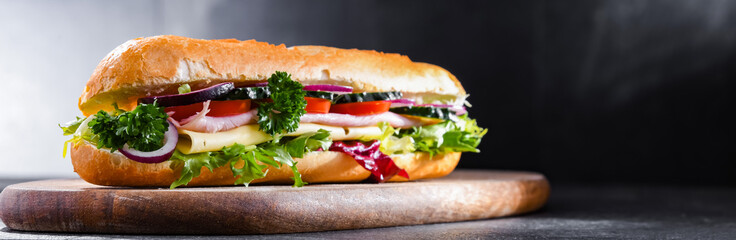 Sandwich with cheese and ham and fresh vegetables