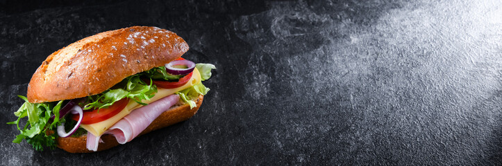 Sandwich with cheese and ham and fresh vegetables