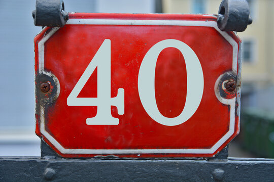 A red number plaque, showing the number forty, 40