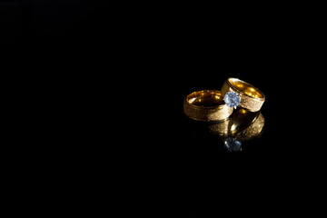 Rings on a dark background. Wedding rings. Jewelry.