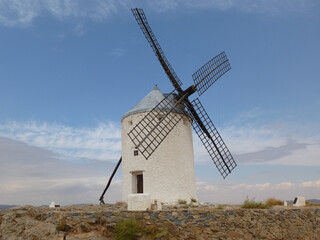 Traditional white Spanish windmill in Castilla La Mancha. Scenario of Don Quixote novel