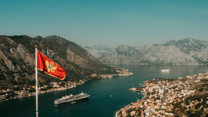 Montenegro's Flag waving at the top of Kotor Fortress in Bay of Boka, Montenegro © Rita
