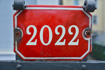 A red house number plaque, showing the two thousand twenty two (2022) 