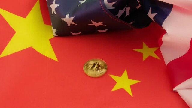 Bitcoin cryptocurrency spinning on top of the flags of China and the United States. Concept of the struggle of the countries.