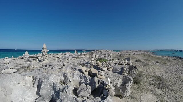 Real-time video panoramic view of stone pyramids in Illetes beach of Formentera island in Spain. High-quality FullHD footage