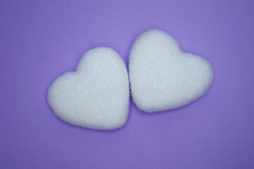 A Valentine's Day card. Valentine's Day background. Two shaggy white Valentine hearts purple...