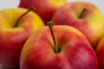 Closeup of apple with a stalk on a white