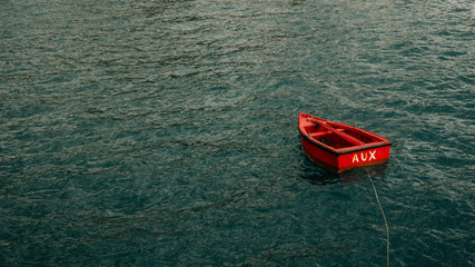 Red Auxiliar Boat in Blue Water, Madeira, Portugal