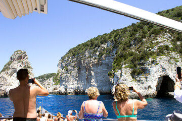 BEAUTIFUL BLUE SEA WILD ROCKS AND BEAUTIFUL CAVES ON THE ISLANDS OF THE IONIAN SEA, PAXOS, AND ANTIPAXOS IN  - 482166312