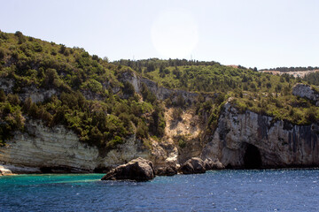 BEAUTIFUL BLUE SEA WILD ROCKS AND BEAUTIFUL CAVES ON THE ISLANDS OF THE IONIAN SEA, PAXOS, AND ANTIPAXOS IN  - 482166335