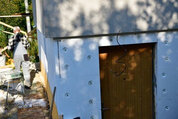 A view at how to insulate the wall with nails and polystyrene