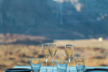 Glass, cup, plates and cuttlery on a wooden table