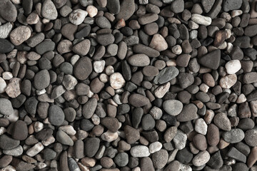 Small stone texture for background. Sea stones background. Flat lay, top view, copy space