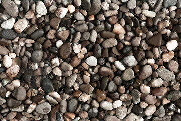 Small stone texture for background. Sea stones background. Flat lay, top view, copy space