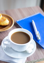 cup of coffee cakes and a note breakfast food tasty table wooden work office business style working hot drink espresso latte caffeine brown aroma sugar break beverage