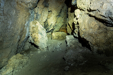 Rock formations inside a cave. Speleology and geology concept.