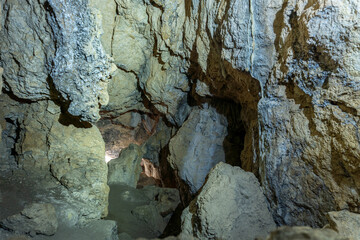 Rock formations inside a cave. Speleology and geology concept.