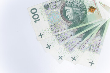 One hundred zloty - Polish banknote. Polish currency on a white background arranged in a pattern. Illustrates cash flow and business