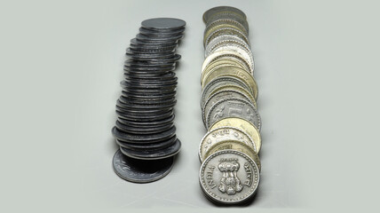 Pile of Indian Rupee Coins. rupee silver coins and five rupees coin stacked. On a white background