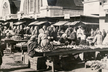 Latvia - CIRCA 1940s: Vintage archive photo of Riga Central Market. People trading all kinds of...