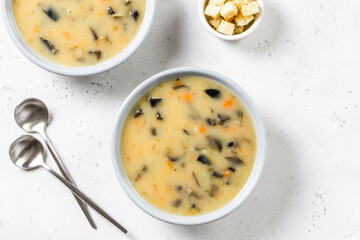 Creamy mushroom soup. Top view, copy space.
