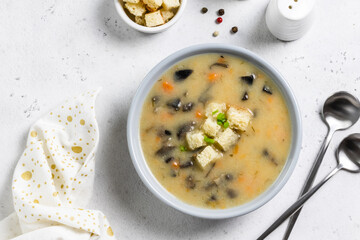 Mushroom soup with croutons. Top view, copy space.