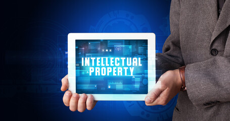 Person holding tablet, security concept