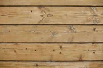 wooden boards texture close up. Vintage wooden surface background. Unpainted natural hardwood boards texture. Weathered surface of the old planks of wooden wall close-up. High contrast wood texture.