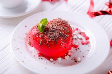 Heart-shaped cake with chocolate on a white background. Valentine's Day