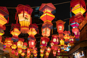 Colorful lanterns hang on the wall